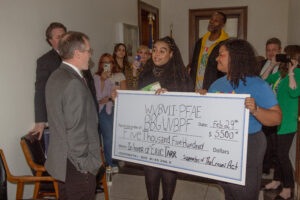 Black advocacy groups present $5,500 check in front of Senate Finance office to protest demise of CROWN Act